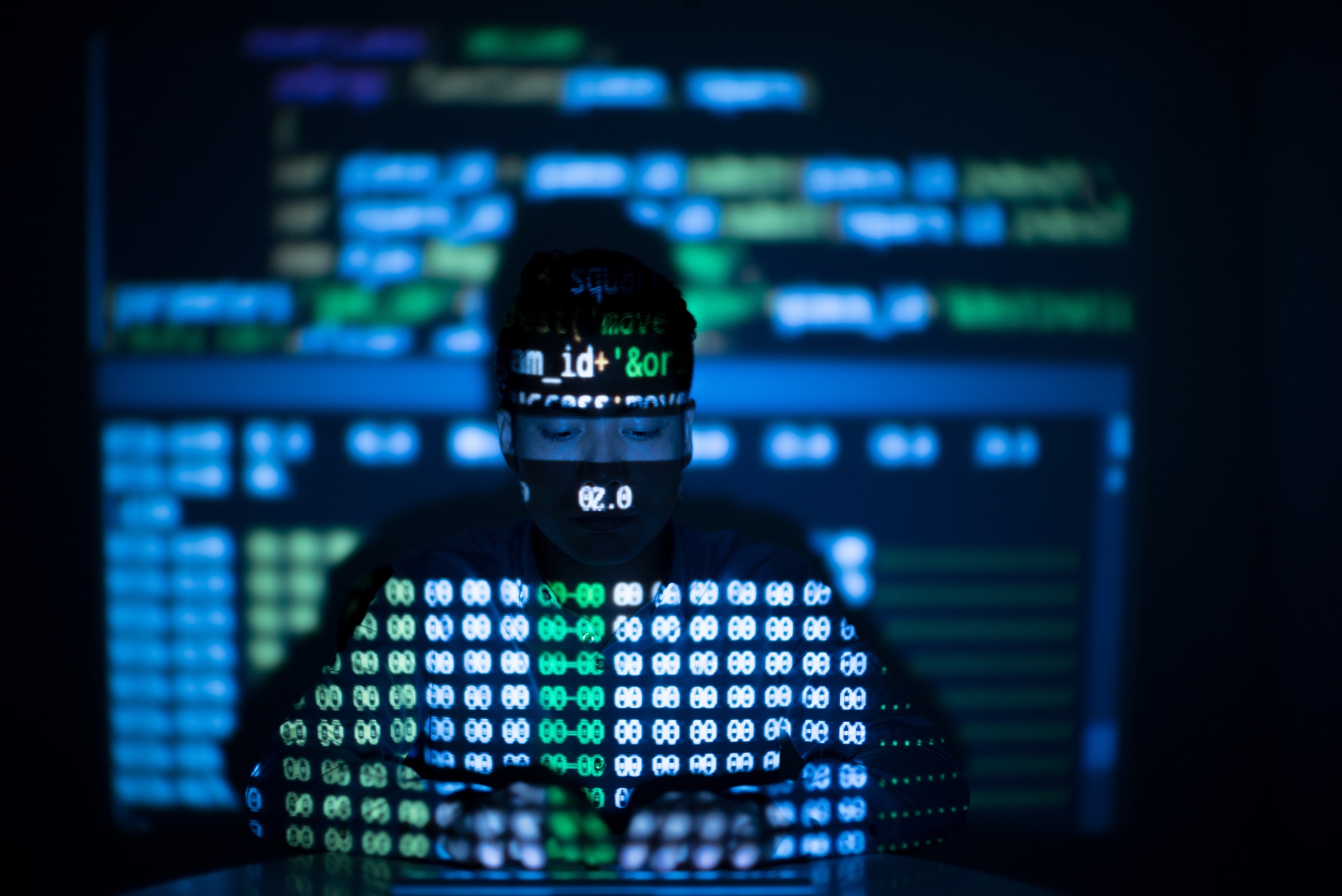 Anonymous hacker in glowing computer interface, scanning for sites that have no security headers to hack.